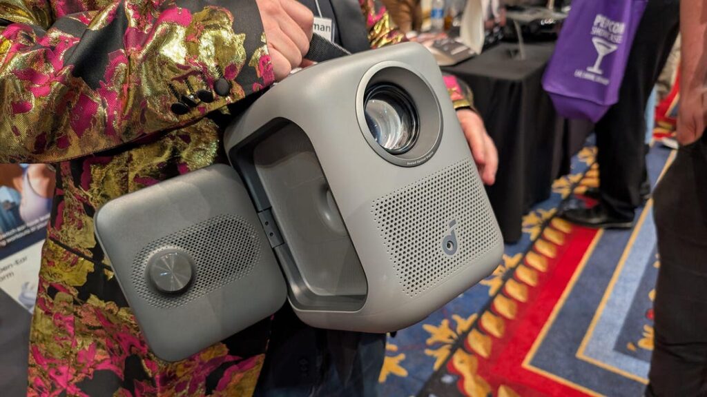 anker's p1i portable projector has rotatable speakers you can point at your ears